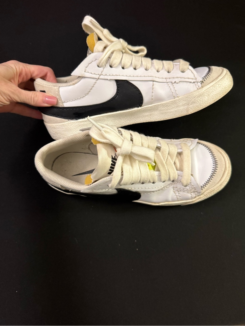 White Nike Sneakers with Black Swoosh